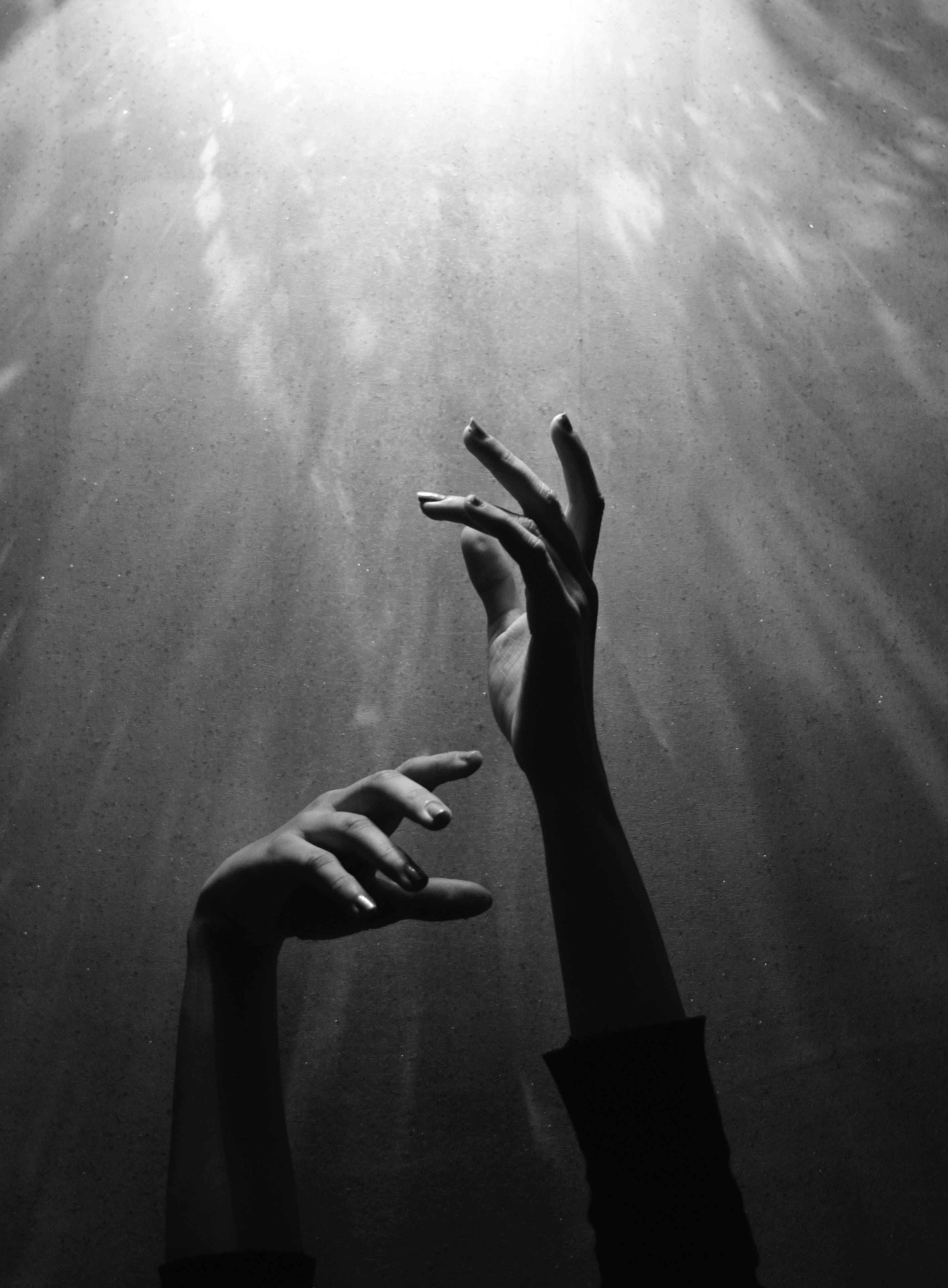 person raising both hands