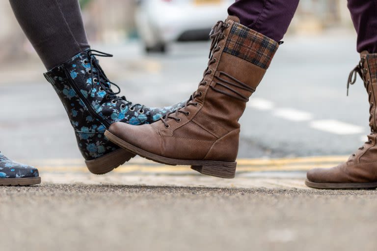 selective focus photo of baby playing activity cube