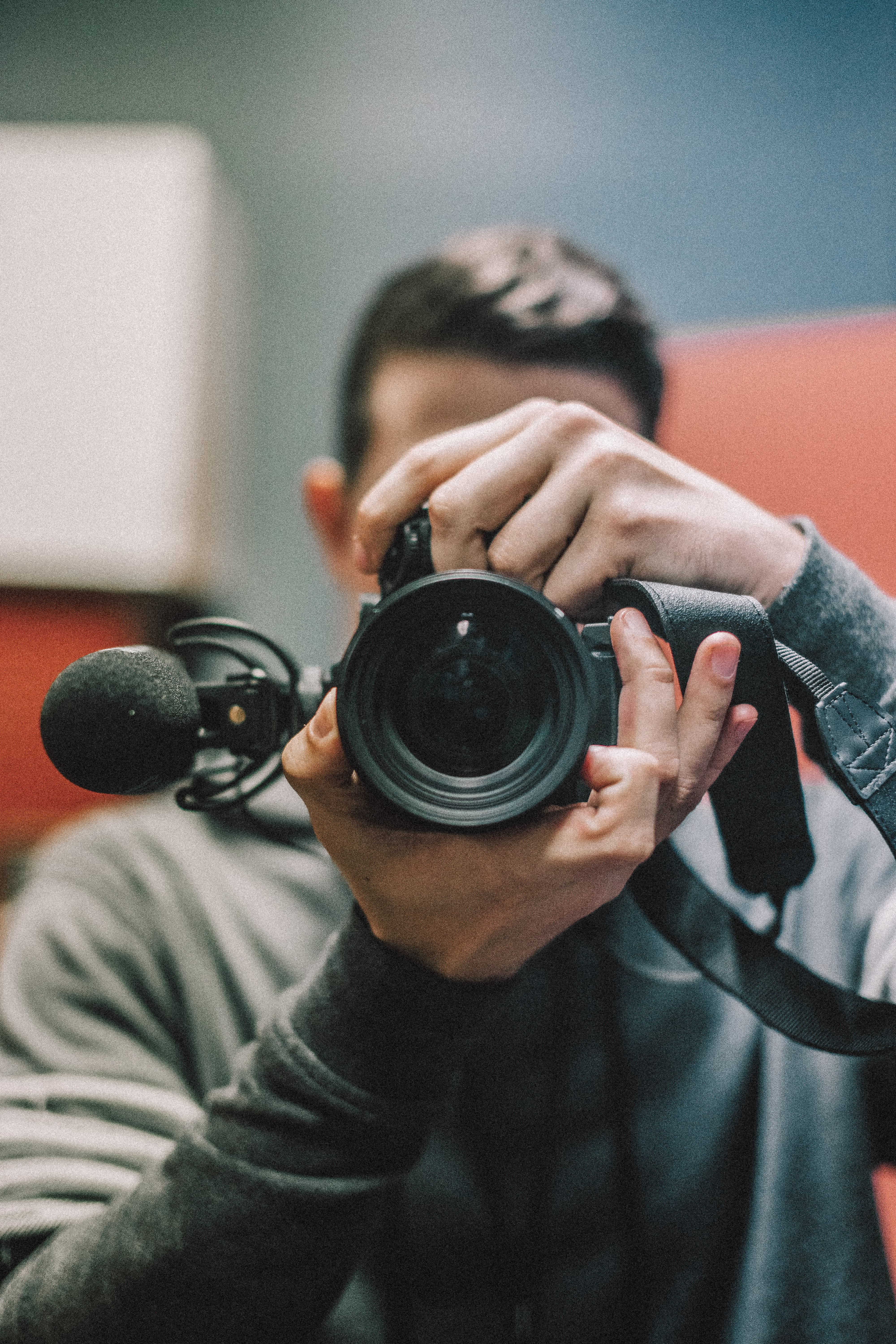 man holding DSLR camera at daytime