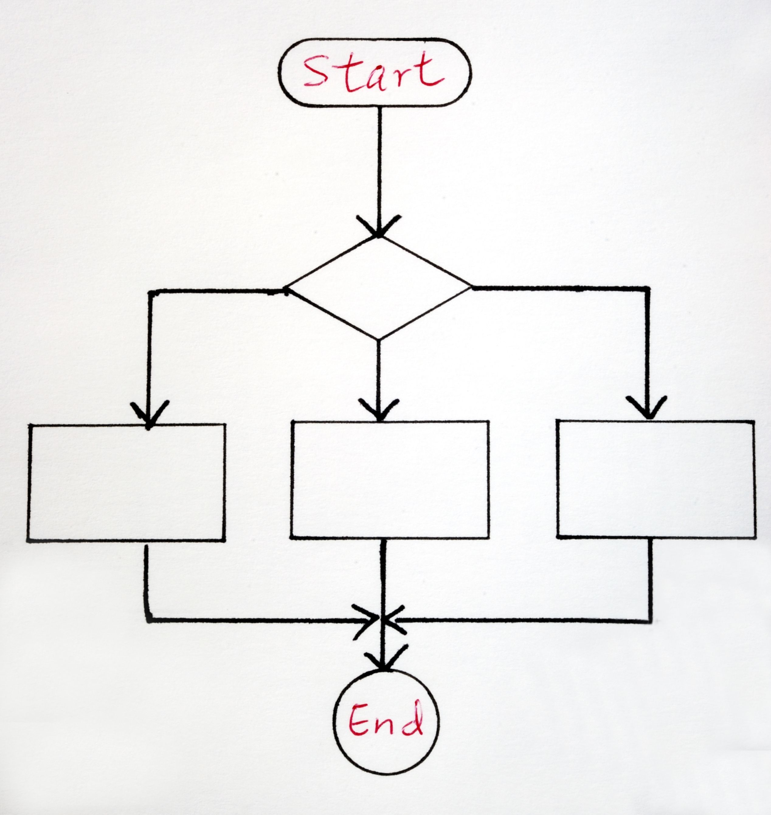 round analog watch with black leather strap on top of white wooden surface